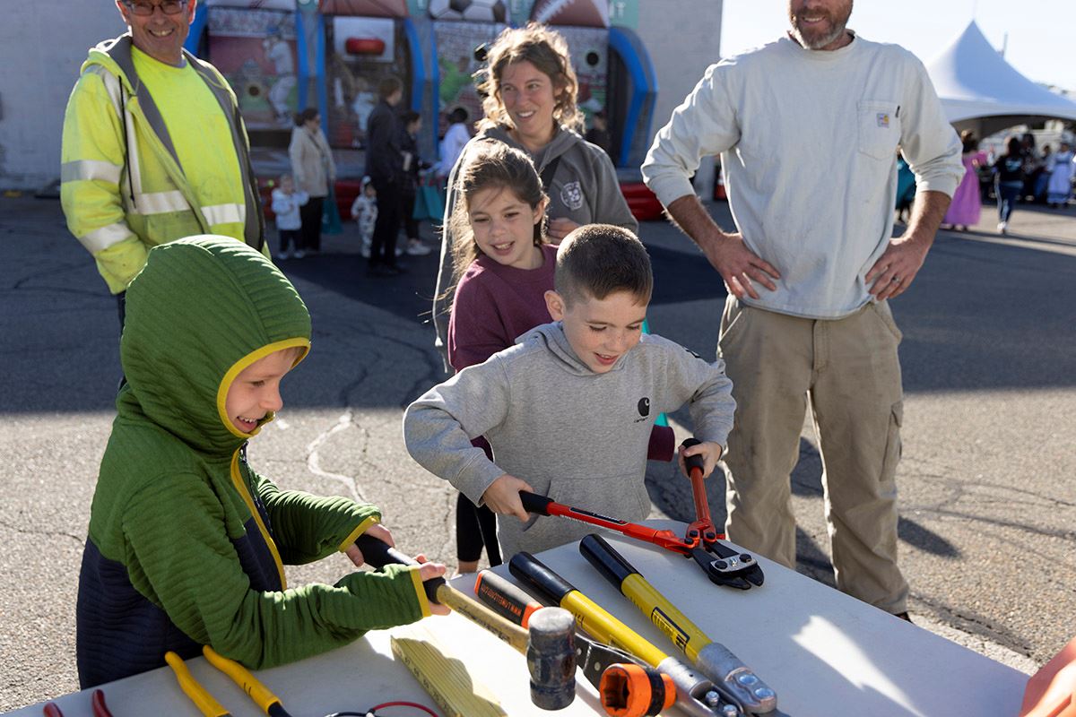 Event attendees explore tools used by lineworkers at the RMLD open house. 